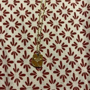 Gold starburst pendant necklace